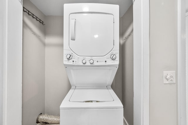 laundry area with stacked washer and dryer