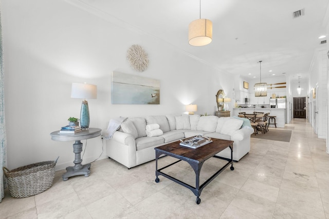 living room featuring crown molding