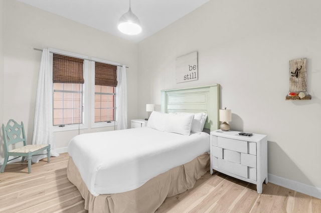 bedroom with light hardwood / wood-style flooring