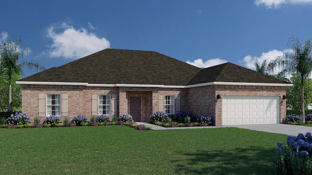 view of front of house with a front yard and a garage