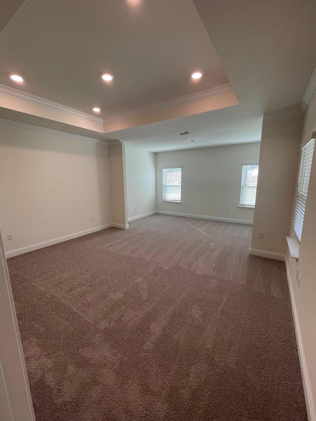 836 Coastal Breeze Dr, Freeport, FL 32439 - unfurnished room featuring crown molding, a raised ceiling, light carpet, recessed lighting, and baseboards
