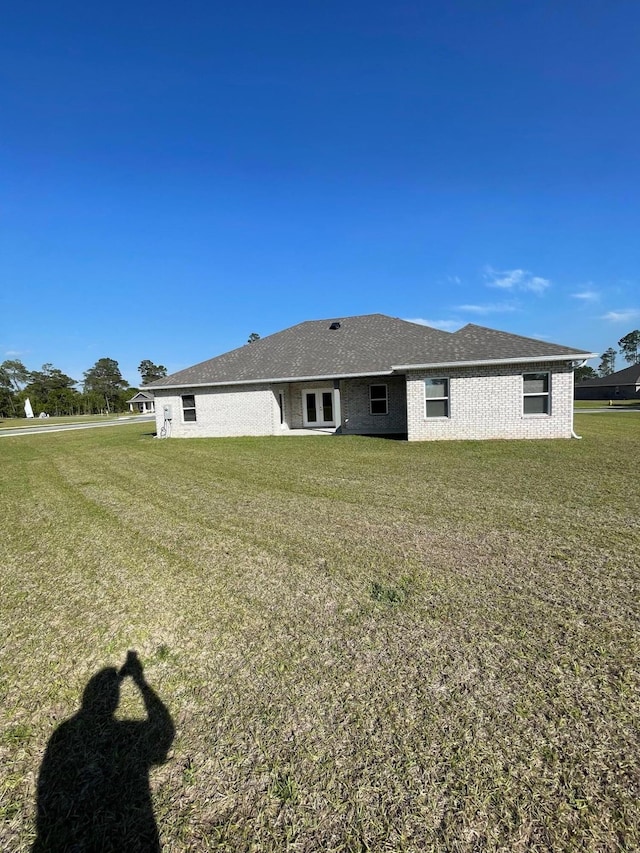 836 Coastal Breeze Dr, Freeport, FL 32439 - rear view of property featuring a lawn
