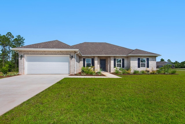 836 Coastal Breeze Dr, Freeport, FL 32439 - view of front of house with a garage, driveway, brick siding, and a front lawn