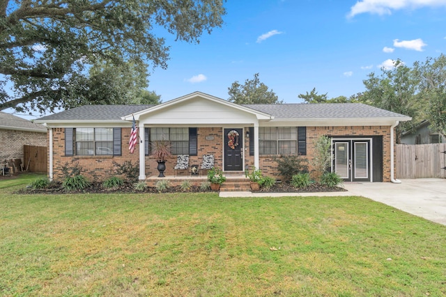 single story home featuring a front lawn and a porch