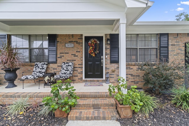 doorway to property featuring covered porch