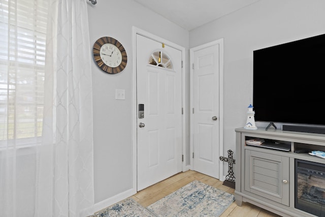 entryway featuring a healthy amount of sunlight and light hardwood / wood-style floors