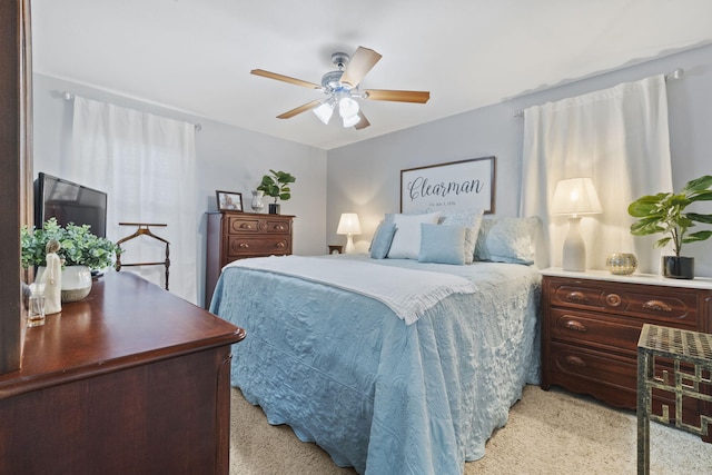 carpeted bedroom with ceiling fan