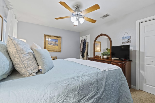 bedroom with ceiling fan and light carpet