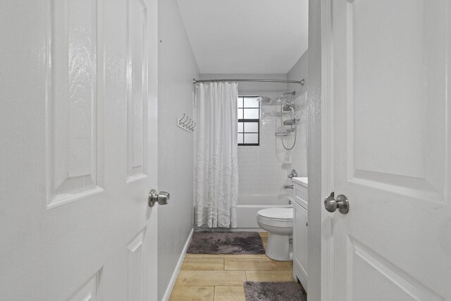 full bathroom with shower / bath combo, vanity, toilet, and hardwood / wood-style floors