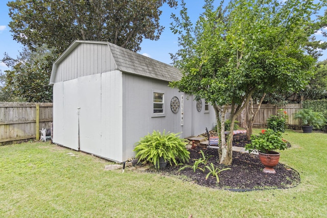 view of outbuilding featuring a yard