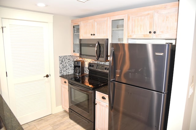 9200 Baytowne Wharf Blvd Unit 444/446, Miramar Beach, FL 32550 - kitchen featuring appliances with stainless steel finishes, glass insert cabinets, decorative backsplash, light wood-type flooring, and light brown cabinets