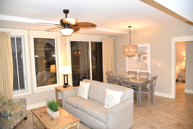 living room featuring ceiling fan and light wood-type flooring