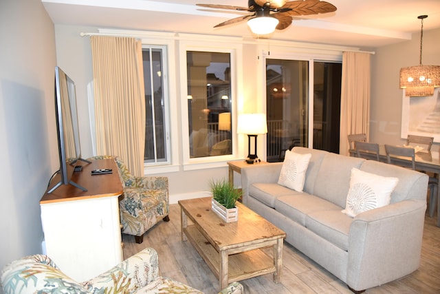 living room with ceiling fan and light hardwood / wood-style floors