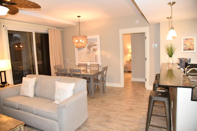 9200 Baytowne Wharf Blvd Unit 444/446, Miramar Beach, FL 32550 - living room with ceiling fan, baseboards, and light wood-type flooring