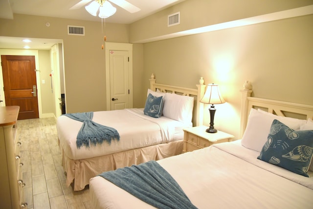 bedroom featuring light hardwood / wood-style flooring and ceiling fan