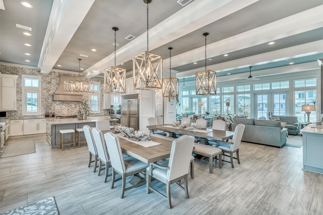 dining room with light wood-type flooring and ceiling fan