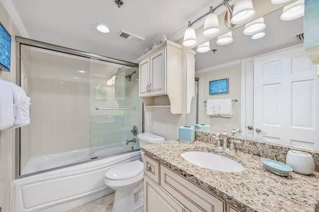 full bathroom with combined bath / shower with glass door, vanity, crown molding, tile patterned flooring, and toilet