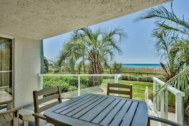 balcony featuring a water view