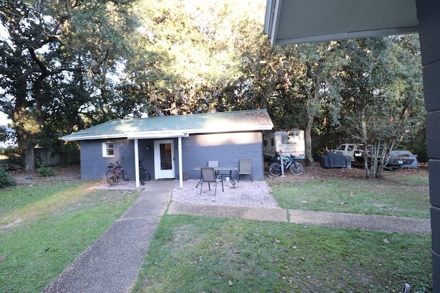 exterior space featuring a yard and a patio area