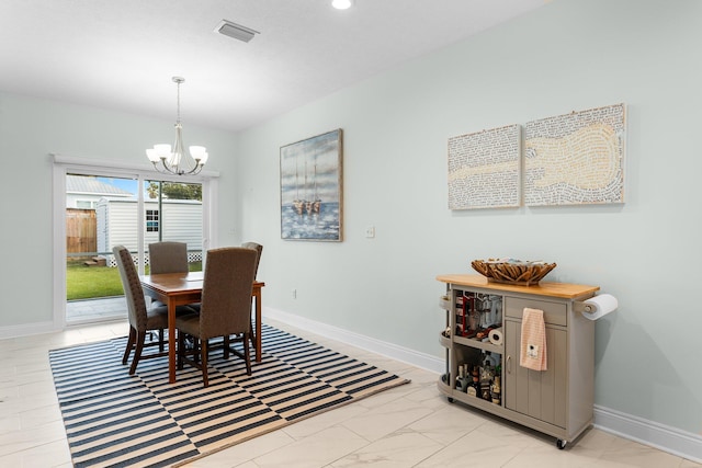 dining area with a chandelier