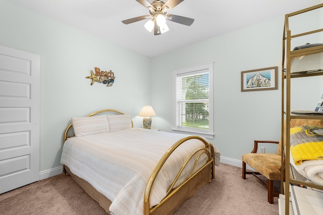 bedroom with light colored carpet and ceiling fan