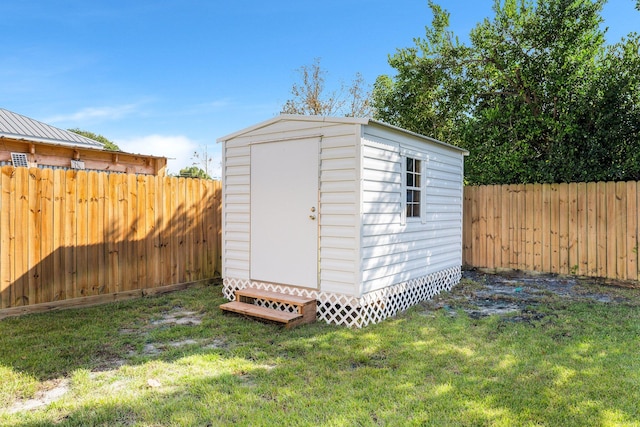 view of outdoor structure with a yard