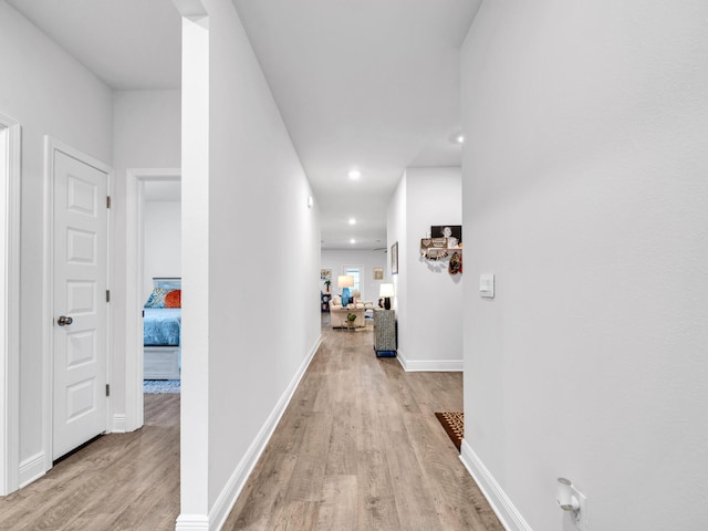 131 W Oak Trees Ln, Freeport, FL 32439 - hallway featuring light wood-style flooring, recessed lighting, and baseboards