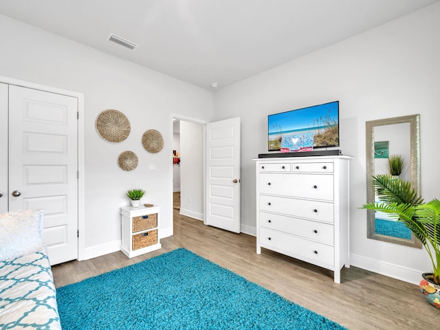 unfurnished bedroom featuring hardwood / wood-style flooring