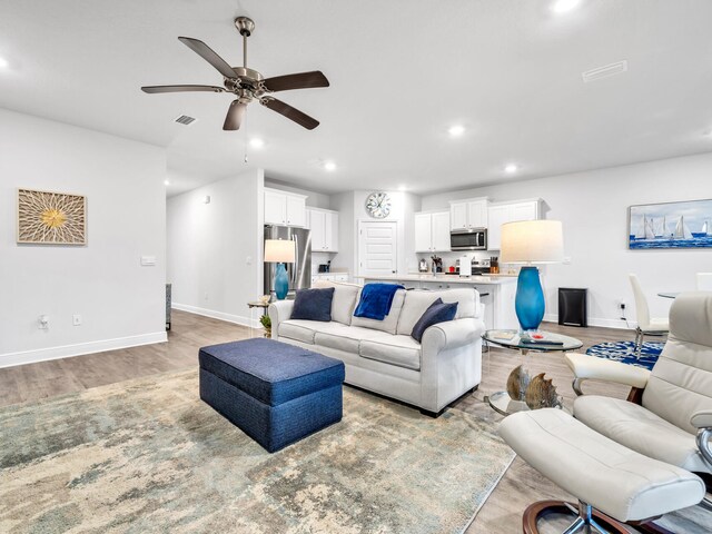 131 W Oak Trees Ln, Freeport, FL 32439 - living area featuring baseboards, light wood-style flooring, ceiling fan, and recessed lighting
