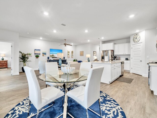 131 W Oak Trees Ln, Freeport, FL 32439 - dining area featuring light wood-type flooring, recessed lighting, a ceiling fan, and baseboards