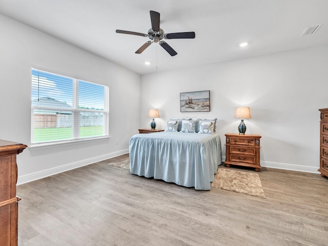 bedroom featuring hardwood / wood-style flooring and ceiling fan