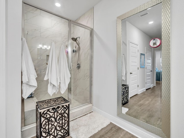 131 W Oak Trees Ln, Freeport, FL 32439 - bathroom with wood finished floors, a shower stall, baseboards, and recessed lighting