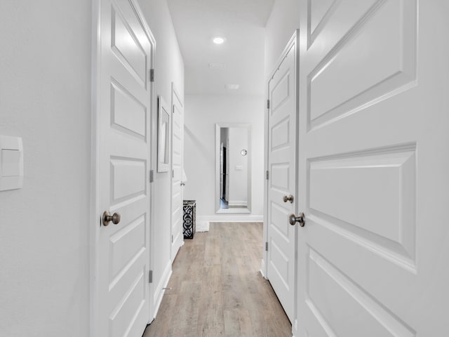 131 W Oak Trees Ln, Freeport, FL 32439 - hallway with light wood-type flooring and baseboards