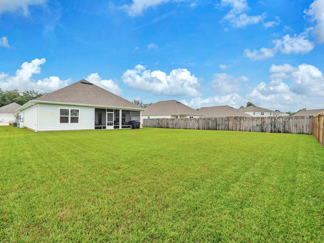 view of yard with a sunroom