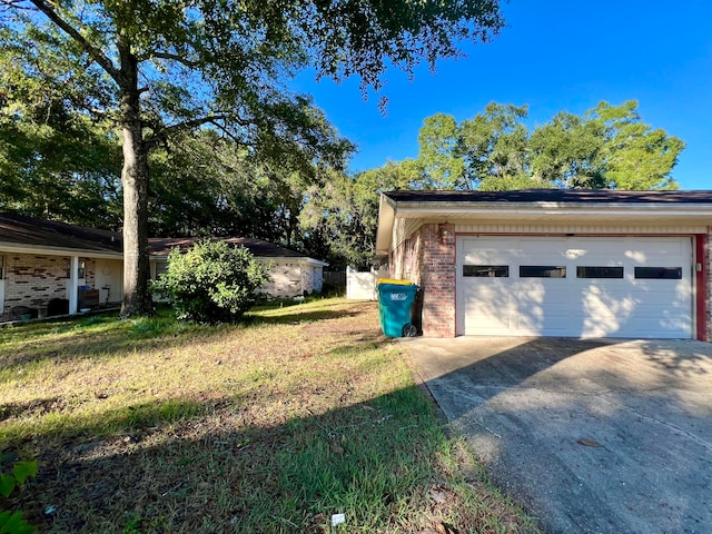 garage featuring a yard