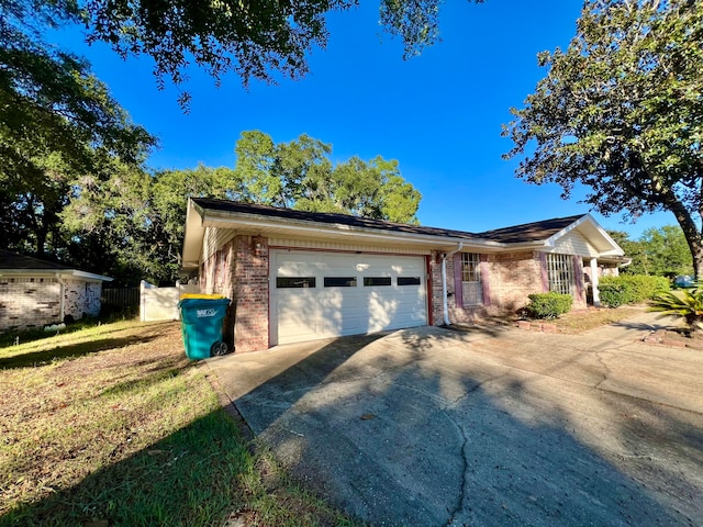 ranch-style home with a garage