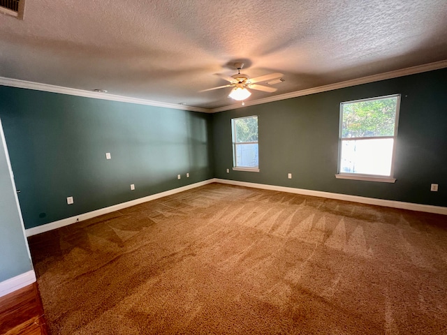 empty room with carpet flooring, ceiling fan, ornamental molding, and a textured ceiling