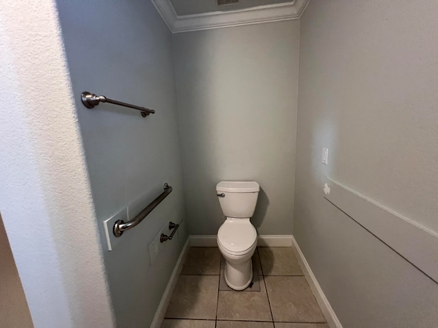 bathroom with tile patterned floors, toilet, and ornamental molding