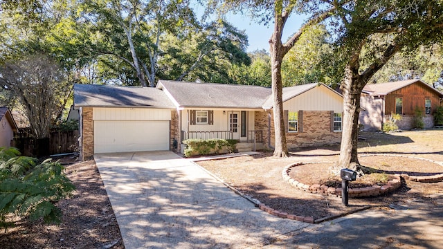 ranch-style house with covered porch and a garage