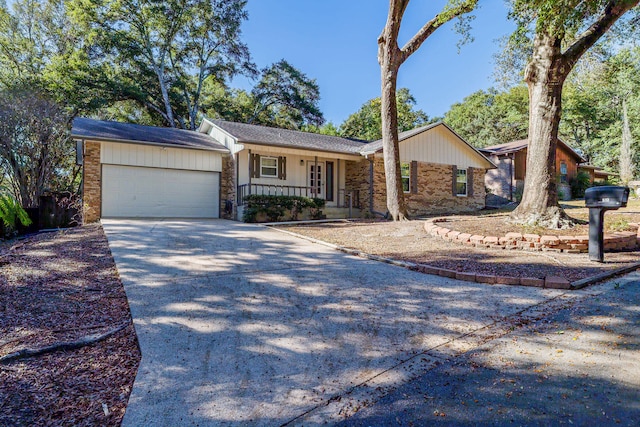 ranch-style house with covered porch and a garage