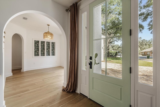 doorway with light hardwood / wood-style floors