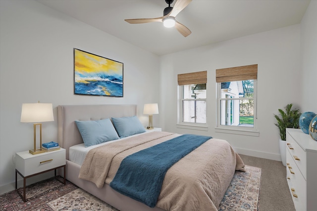 bedroom with dark carpet and ceiling fan