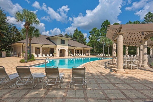 view of swimming pool featuring a pergola and a patio area