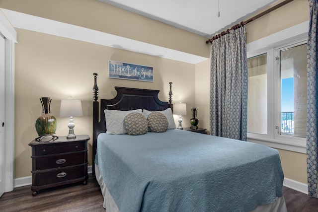 bedroom featuring dark wood-type flooring