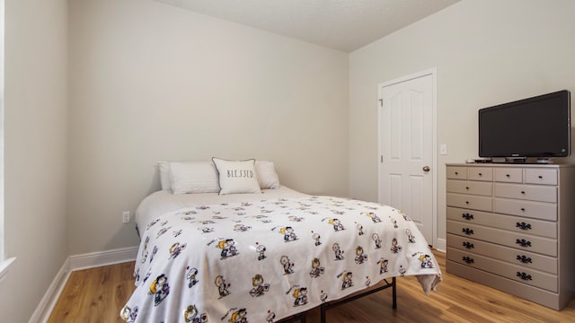 bedroom with light hardwood / wood-style flooring