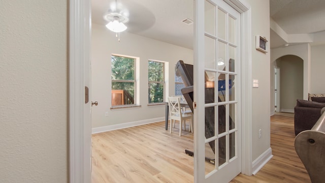 hall with light wood-type flooring