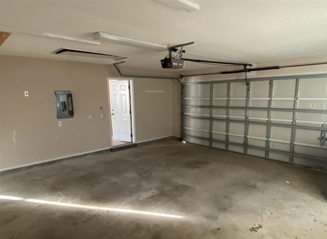 garage with a garage door opener and electric panel