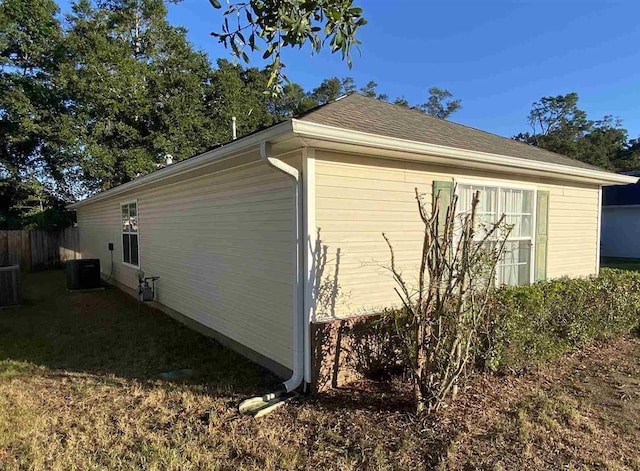 view of side of home featuring central AC unit