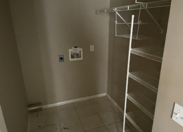 washroom featuring electric dryer hookup, washer hookup, and tile patterned floors