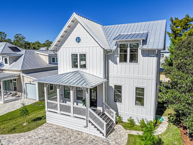 modern inspired farmhouse with covered porch